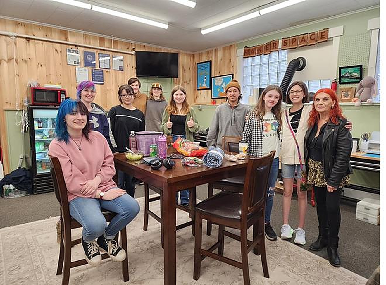 A cohort of young people gathered and working together at CES.